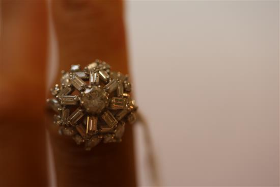 A diamond cluster ring set with brilliants, navette and baguette stones, 18ct white gold and platinum setting, size T.